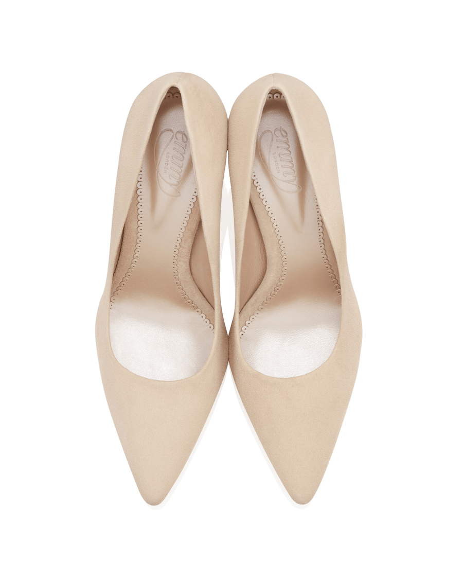 Nude suede pointed-toe heels with a sleek design, shown from a top-down angle against a white background. The shoes feature a smooth interior lining and a subtle stitching detail along the edges. image