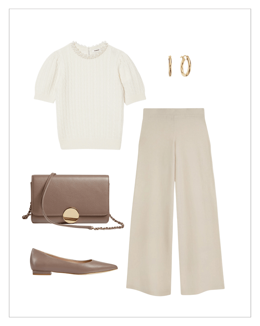 A flat shoe in a soft taupe color, made of leather, is styled with a cream cable-knit sweater, beige wide-leg trousers, and gold hoop earrings. The background is a clean, white space, highlighting the outfit's neutral tones. The shoe is positioned at an angle, showcasing its sleek design. image