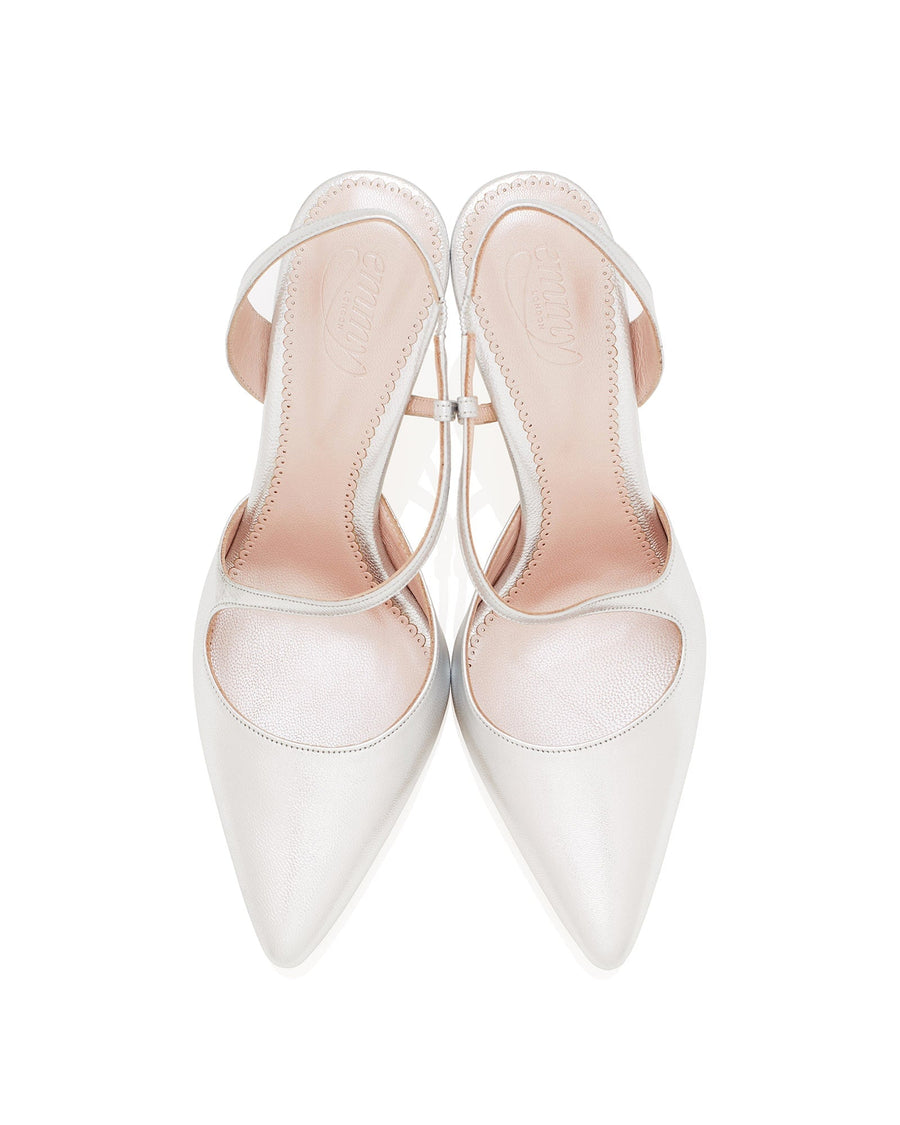 White pointed-toe heels with a sleek design and a delicate ankle strap. The shoes are displayed from a top-down angle against a plain white background, showcasing their smooth finish and elegant silhouette. image