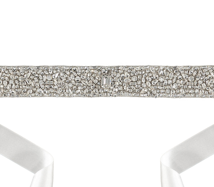 Embellished silver belt with intricate beadwork, featuring a satin ribbon tie. The belt is displayed against a white background, showcasing its detailed design and shimmering elements. image