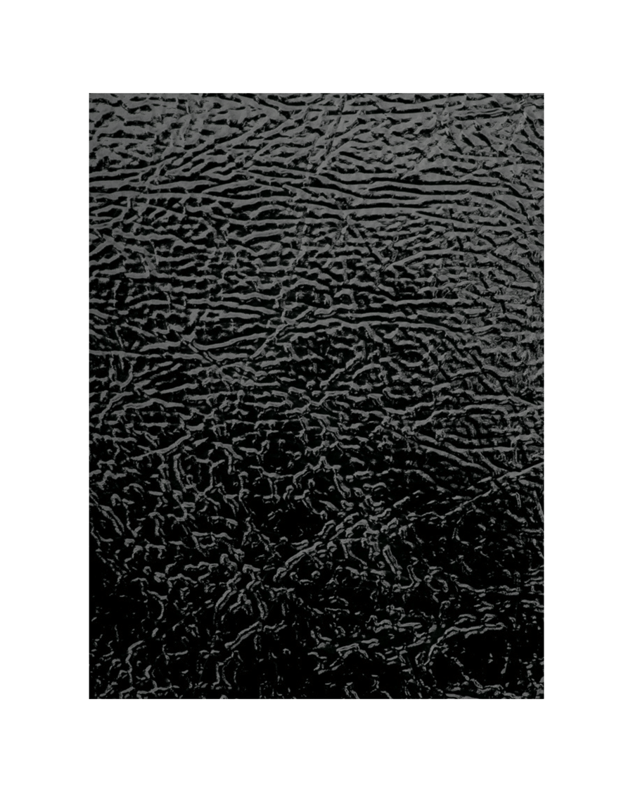 Close-up of a textured black leather surface featuring irregular, wavy lines and creases that create a rugged appearance. Glossy finish highlights subtle reflections, with a plain background emphasizing the material's texture and sheen. image