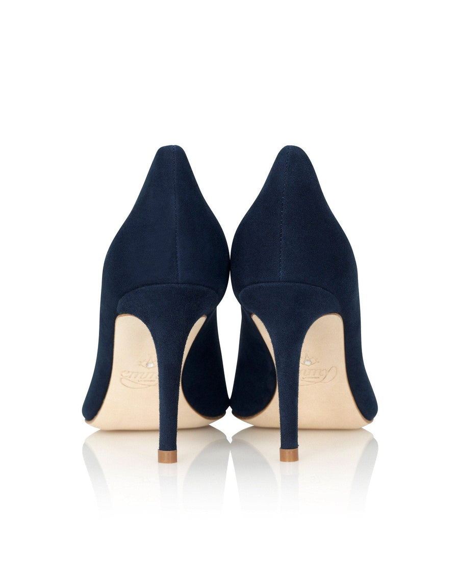 Navy suede heels with a sleek pointed toe design, featuring a stiletto heel. The image is taken from the back, showcasing the smooth texture of the material and the elegant silhouette. The background is plain white, emphasizing the shoes. image
