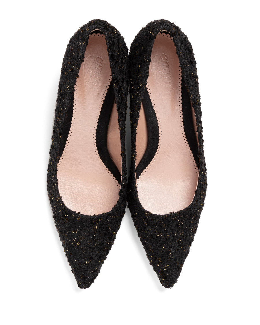 Pair of black pointed-toe shoes on a white background image