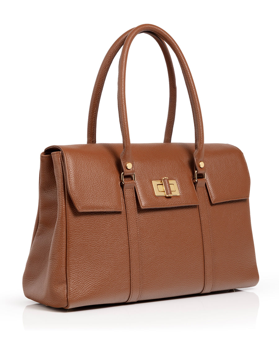 A structured brown pebbled leather handbag with double top handles, a front flap pocket with a gold-tone turn-lock closure, and gold hardware, shown on a white background. image
