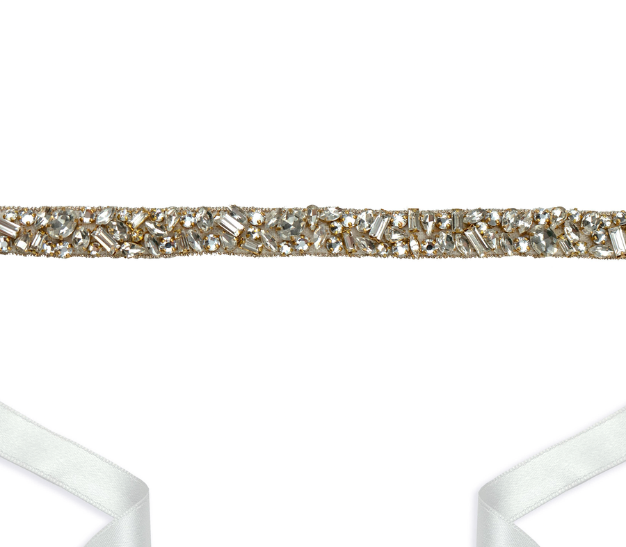 Elegant embellished strap featuring a mix of clear and gold-toned crystals, set against a white background. The strap is designed to be tied around the ankle with a satin ribbon, showcasing a delicate and sophisticated look. image