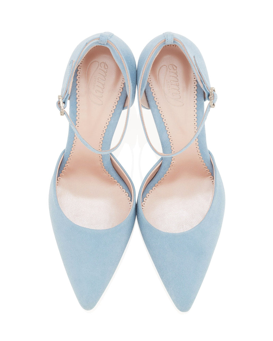 Light blue suede heels with a pointed toe design and a delicate ankle strap. The shoes are displayed from a top-down angle against a white background, showcasing their elegant silhouette and soft texture. image