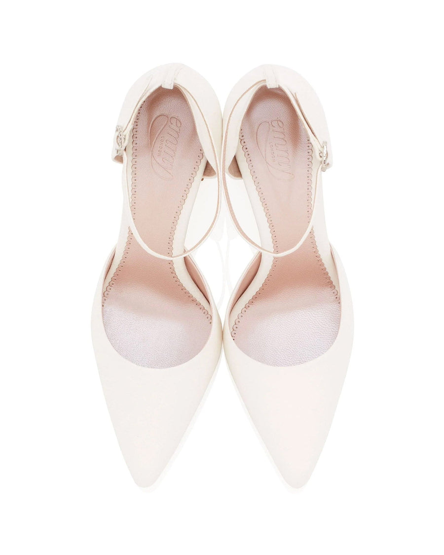 White pointed-toe heels with a sleek design, featuring an ankle strap. The shoes are displayed from a top-down angle against a plain white background, highlighting their elegant silhouette. image