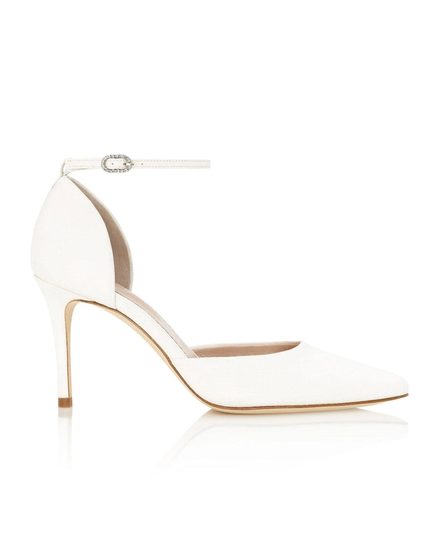 White leather heels with a pointed toe and a delicate ankle strap. The heel height is approximately 4 inches. The shoes are displayed against a clean, reflective surface, highlighting their sleek design. image