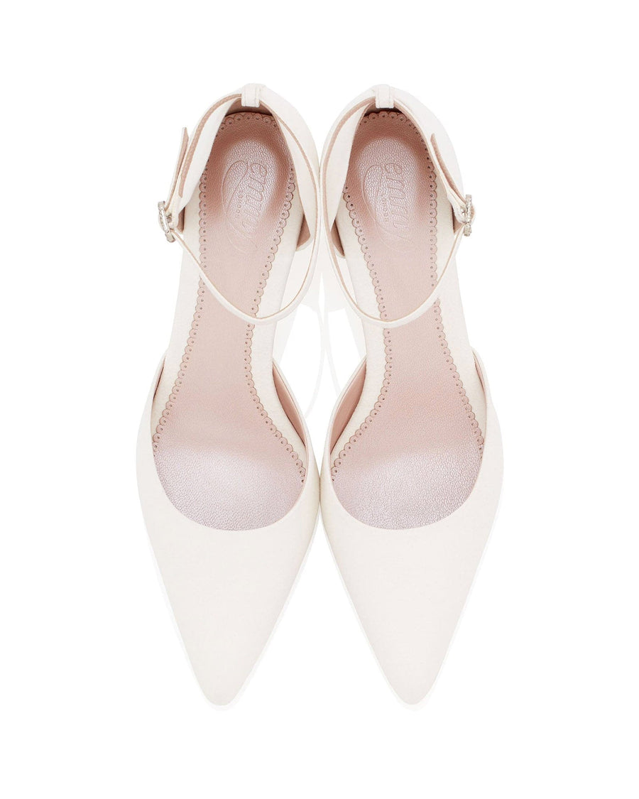 White pointed-toe heels with a delicate ankle strap, featuring a sleek design. The shoes are displayed from a top-down angle against a plain white background, highlighting their elegant silhouette. The interior is softly padded for comfort. image