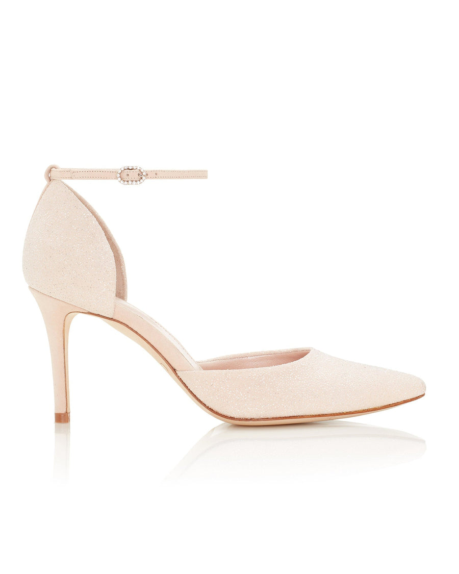 Elegant nude heels with a pointed toe and a delicate ankle strap. The shoes feature a sleek silhouette and are set against a clean white background, showcasing their refined design. The heel height is approximately 10 cm, providing a chic lift. The material appears to be a soft suede, adding a touch of sophistication to the overall look. image