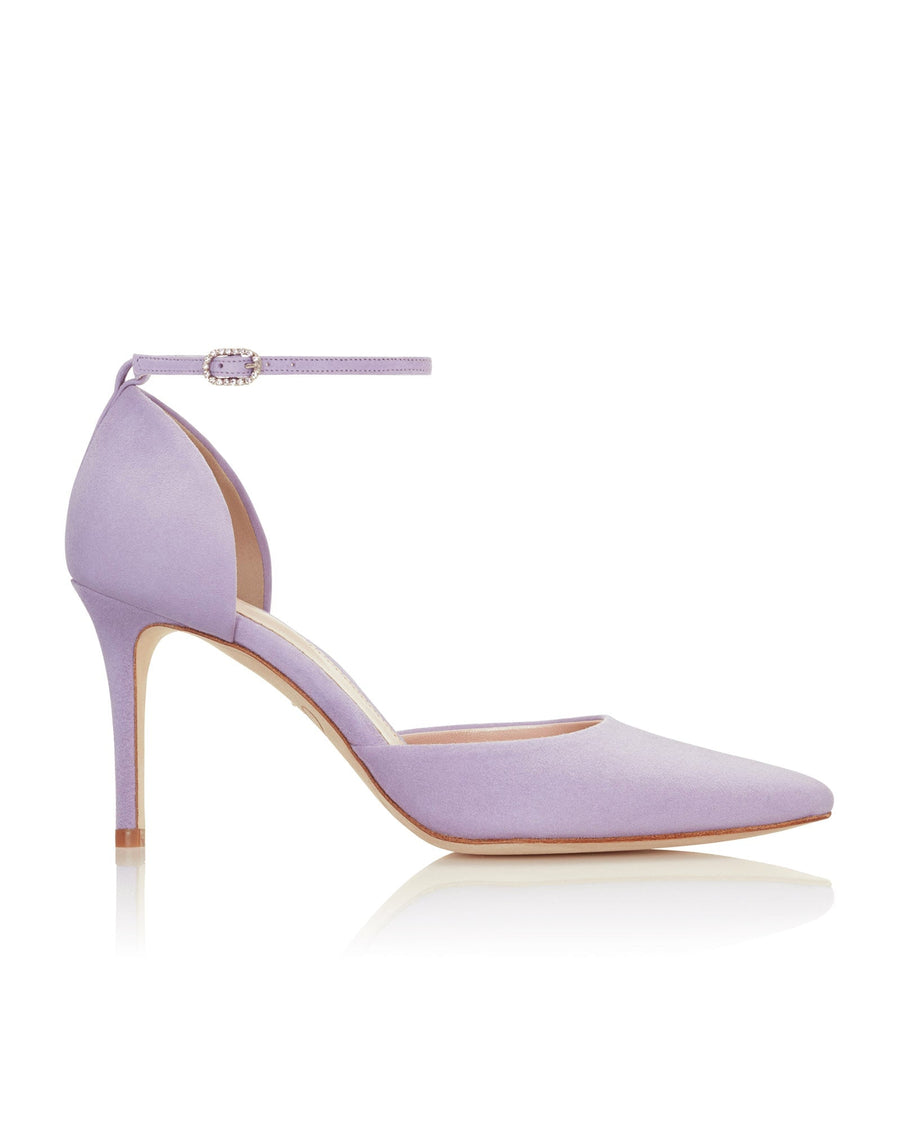 Elegant lavender suede heels with a pointed toe and a delicate ankle strap. The heel height is approximately 3.5 inches. The shoe is displayed against a clean, white background, showcasing its sleek design from a side angle. image