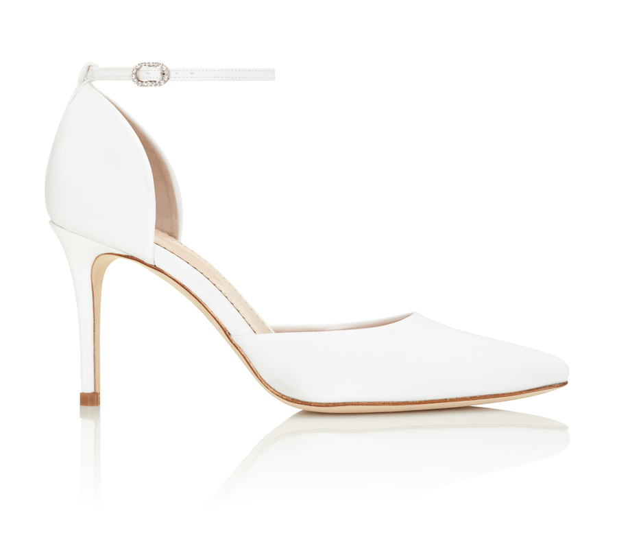 White high-heeled shoes with a pointed toe and ankle strap. The heel is approximately 4 inches tall. The shoes are set against a clean, white background, showcasing their elegant design from a side angle. image
