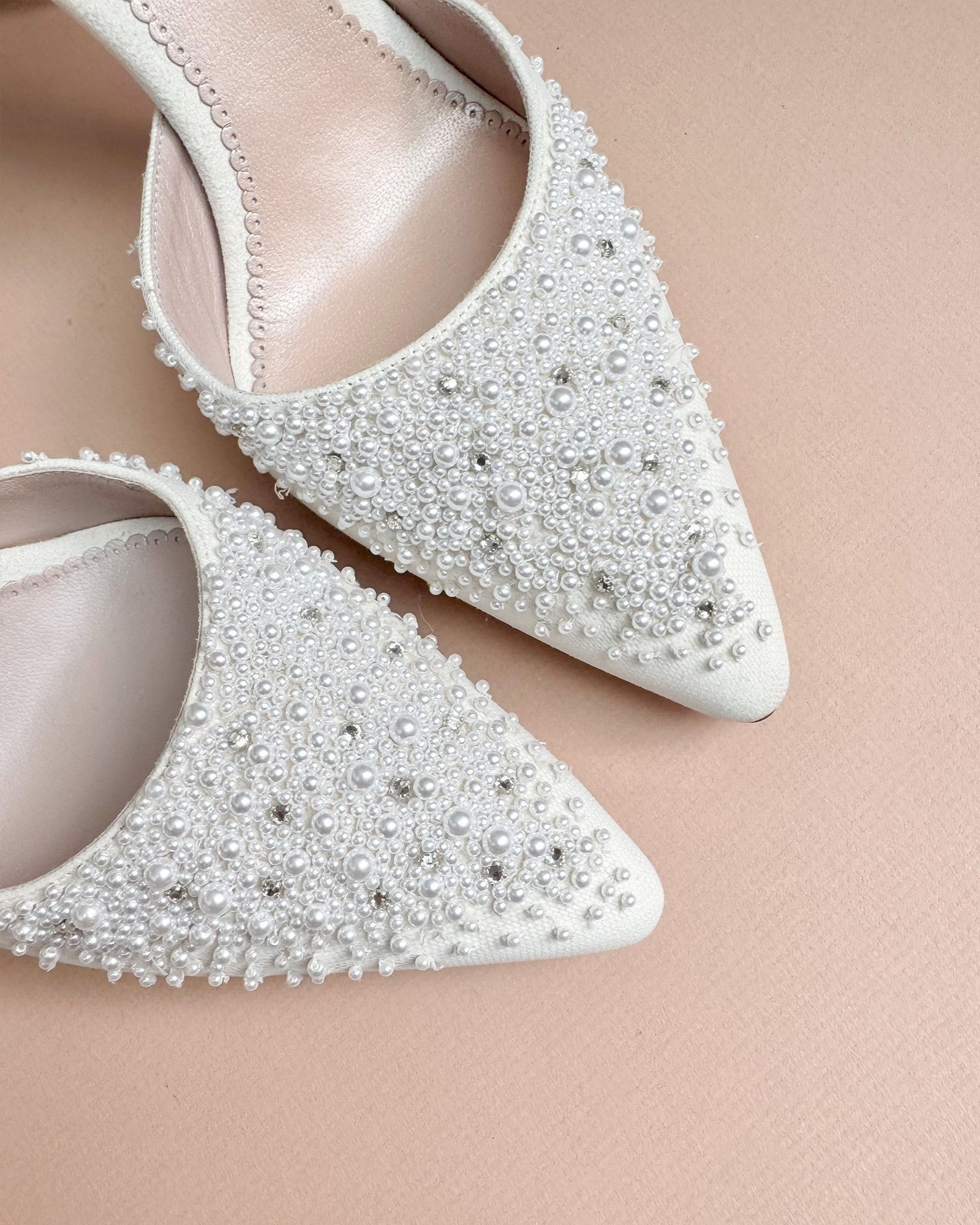 Beaded bridal shoes with pearls and crystals on blush background image