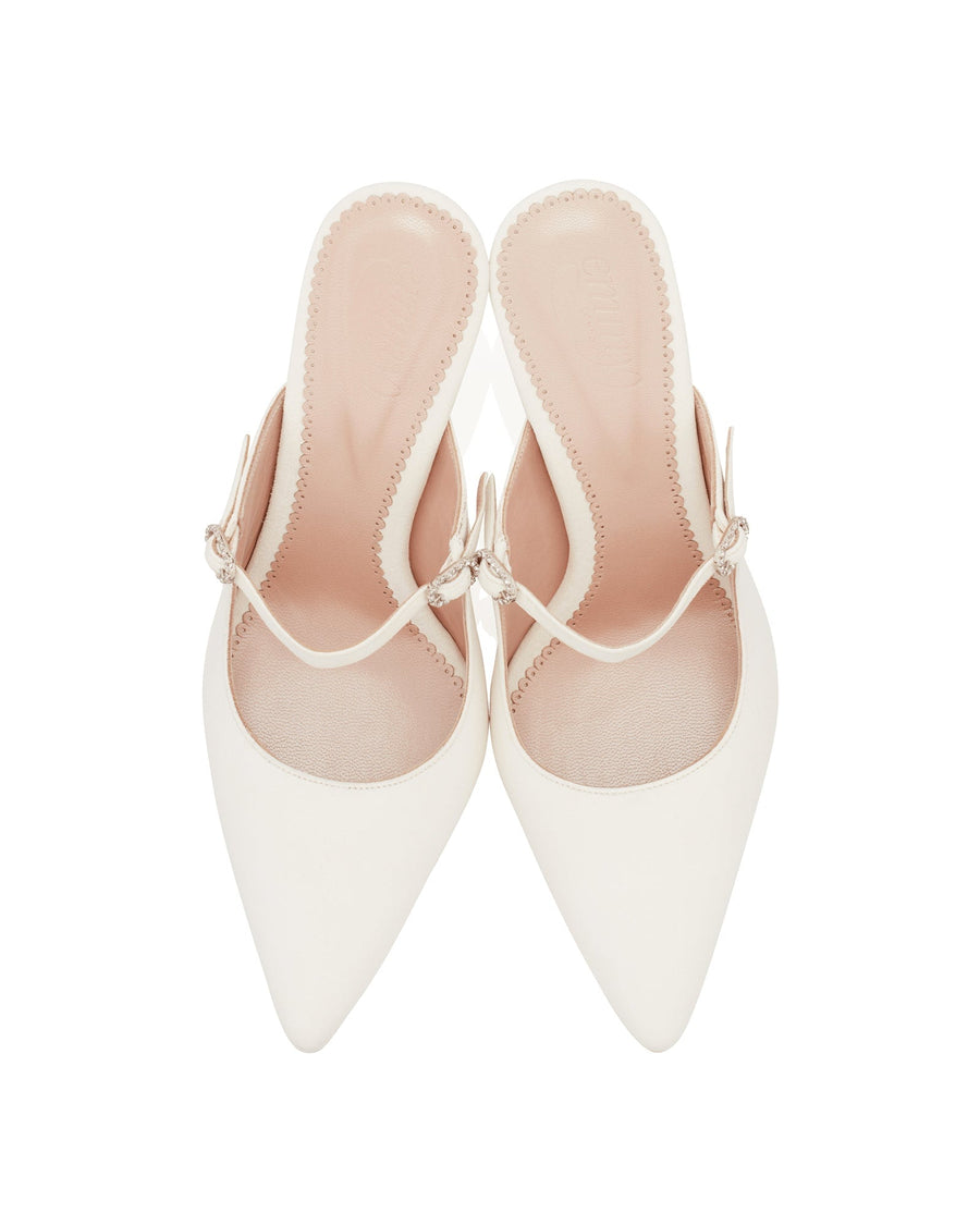 White pointed-toe slingback shoes with a delicate strap featuring a decorative embellishment. The shoes are displayed from a top-down angle against a plain white background. image
