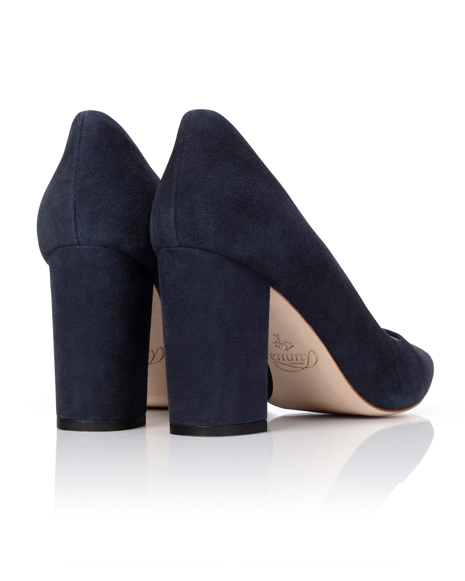 Navy blue high-heeled shoes on a white background image