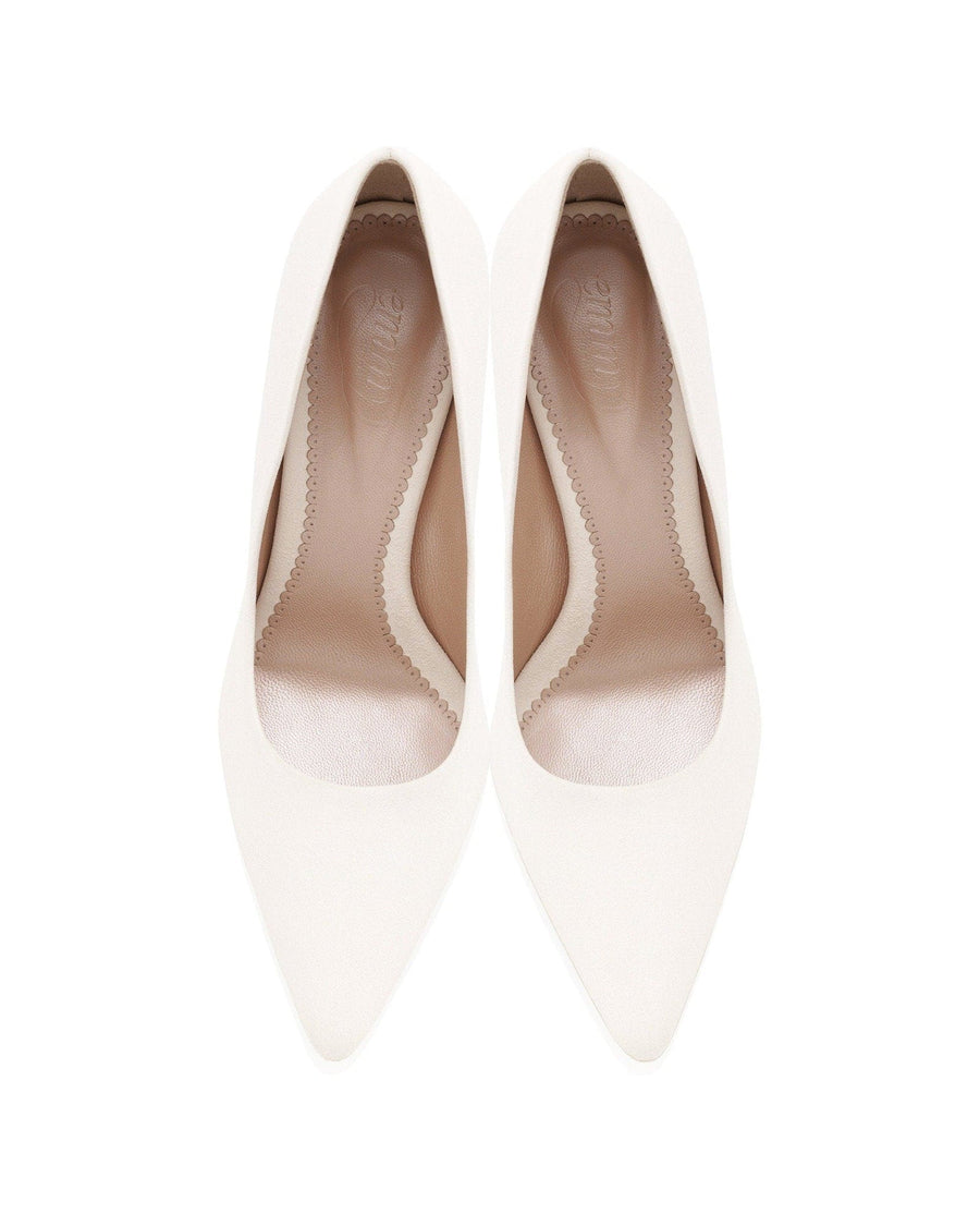 White pointed-toe heels with a sleek design, featuring a smooth upper and a subtle interior lining. The shoes are displayed from a top-down angle against a plain white background, emphasizing their elegant silhouette. image