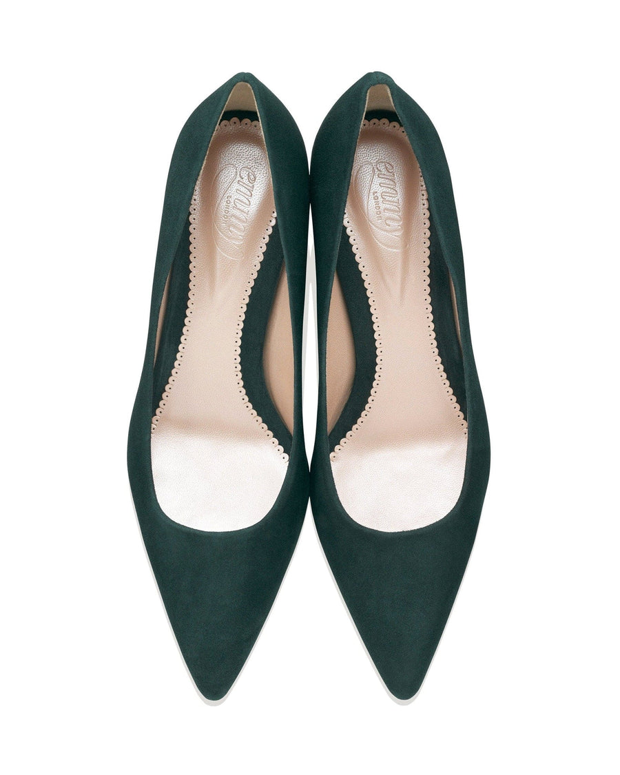 Green suede heels with a pointed toe design, featuring a cut-out detail along the sides. The shoes are displayed from a top-down angle against a white background, highlighting their sleek silhouette. image