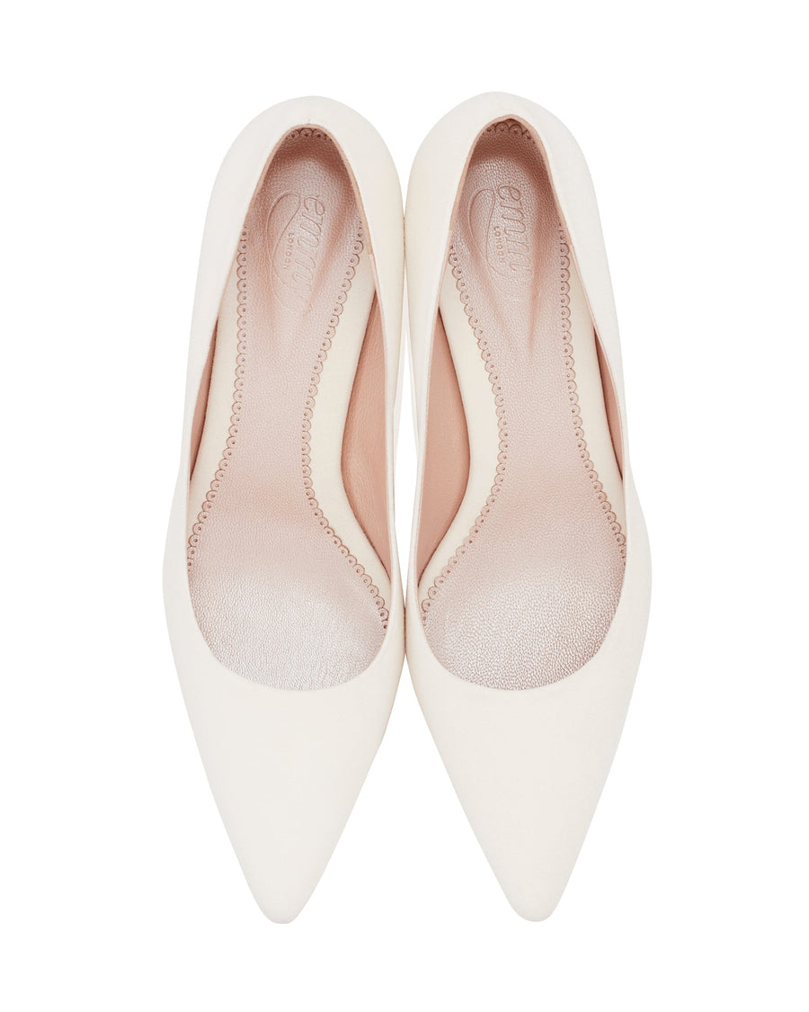 White pointed-toe heels with a sleek design, featuring a smooth upper and a subtle inner lining. The shoes are displayed from a top-down angle against a plain white background, highlighting their elegant silhouette. image