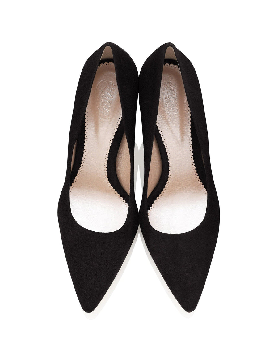 Black suede heels with a pointed toe and a scalloped edge design. The shoes are displayed from a top-down angle against a white background, showcasing their sleek silhouette. image