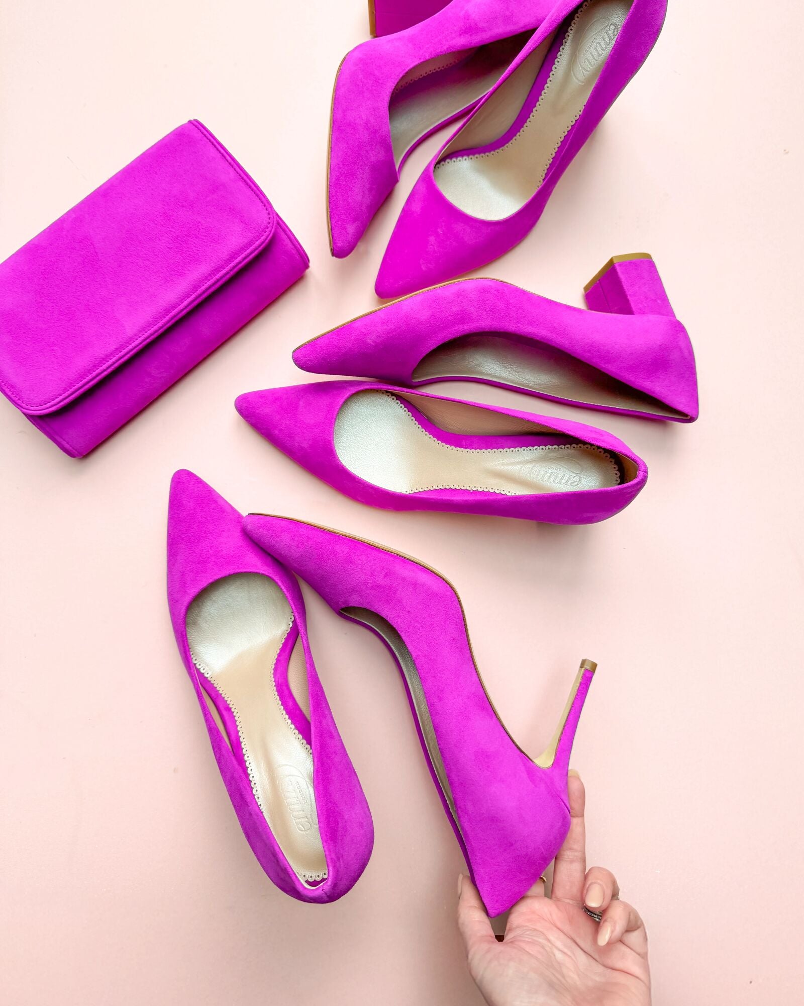 A collection of bright pink magenta shoes  image