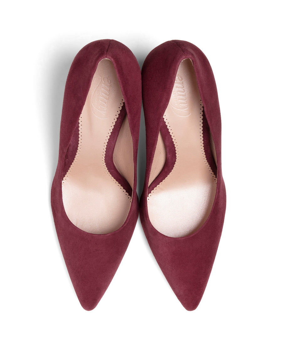 Pair of maroon pointed-toe shoes on a white background image