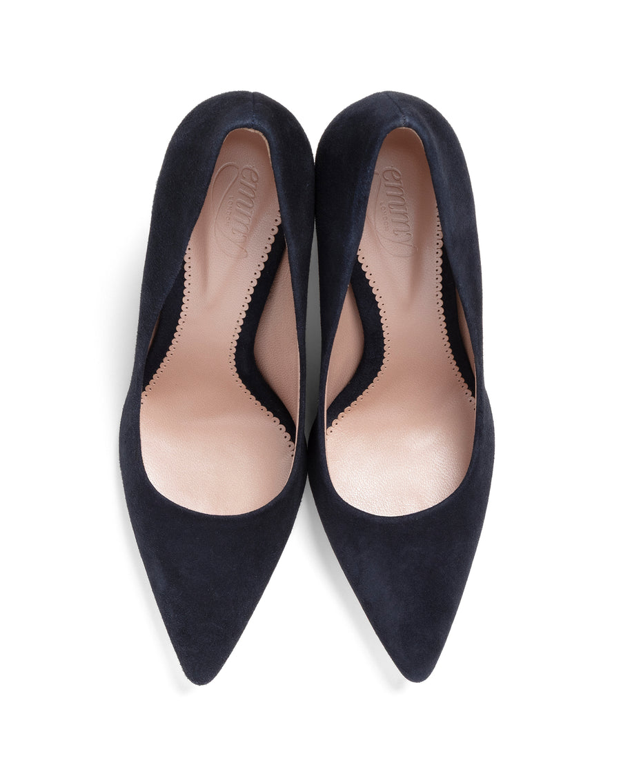 Pair of navy blue high-heeled shoes on a white background image
