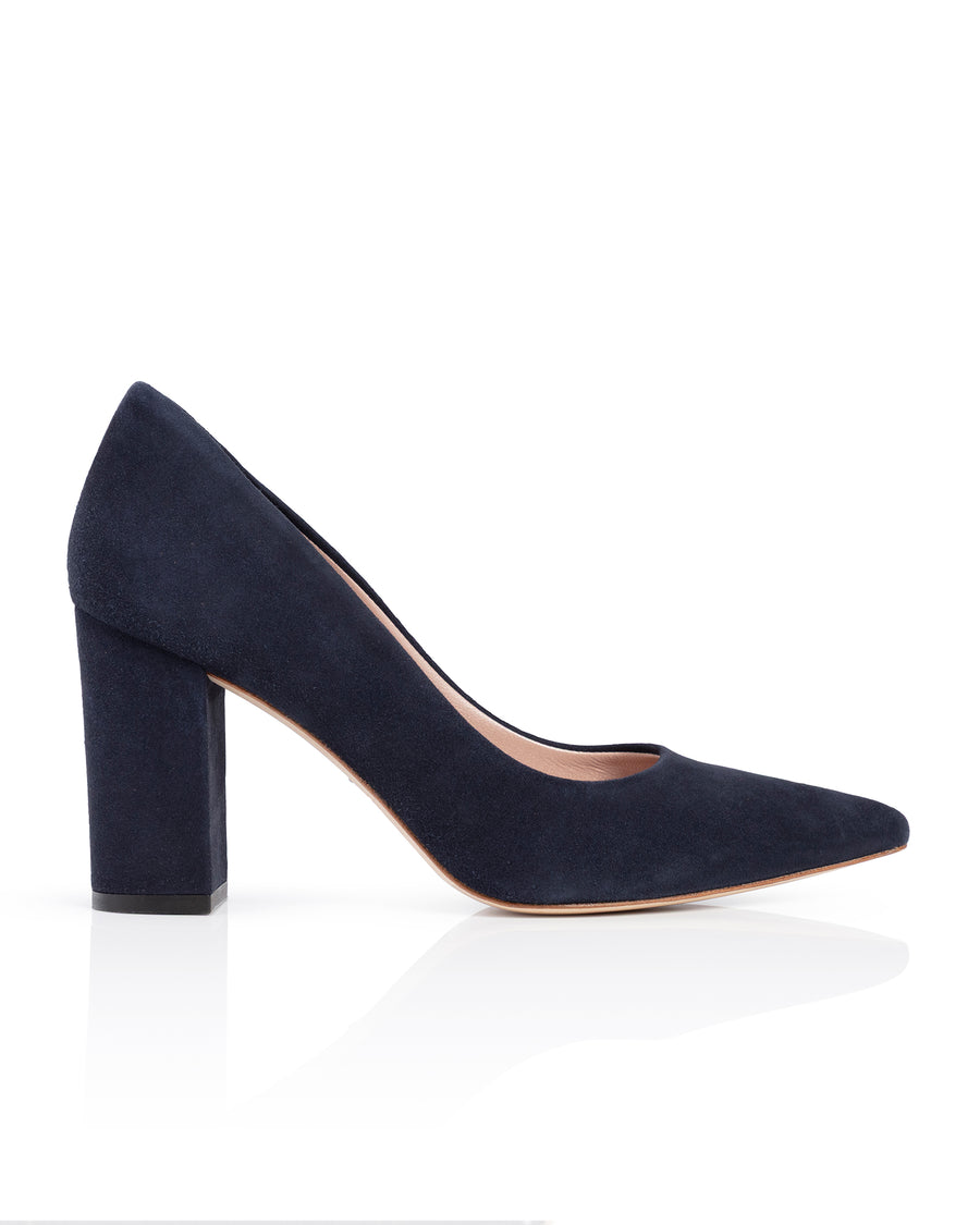 Navy blue suede high heel shoe on a white background image