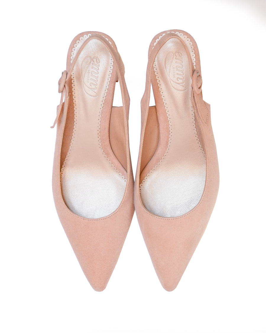Light pink suede slingback heels with a pointed toe design. The shoes feature a delicate bow detail on the side and a smooth interior lining. The image is taken from a top-down angle against a white background, showcasing the shoes clearly without any model wearing them. image