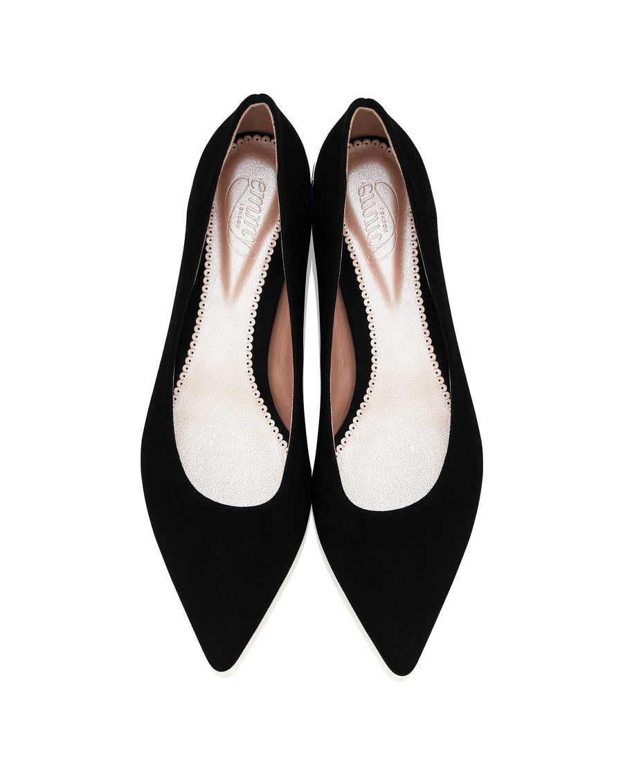 Black suede pointed-toe heels with a sleek design, featuring a smooth interior lining. The shoes are displayed from a top-down angle against a white background, showcasing their elegant silhouette. image