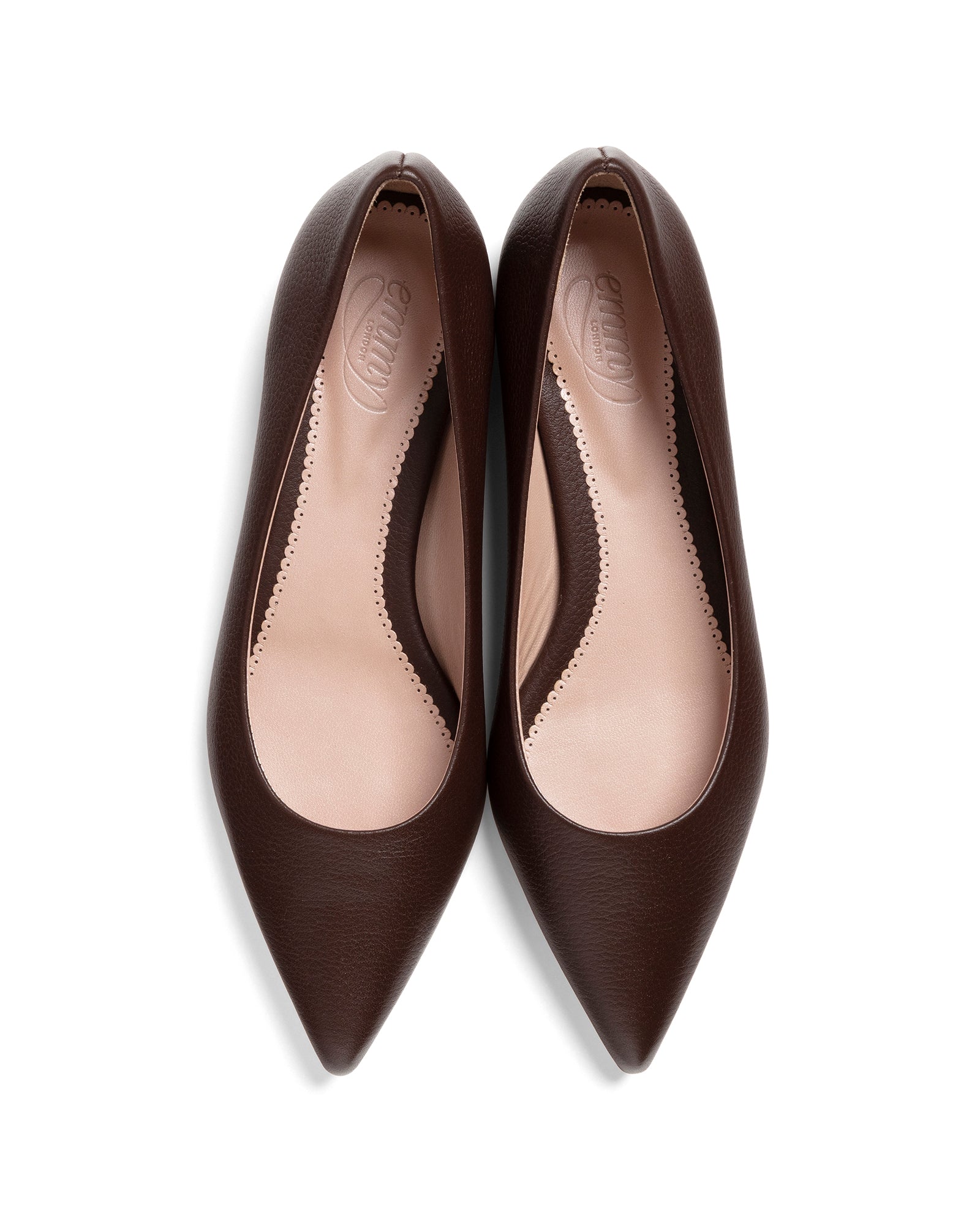 Pair of brown pointed-toe shoes on a white background image