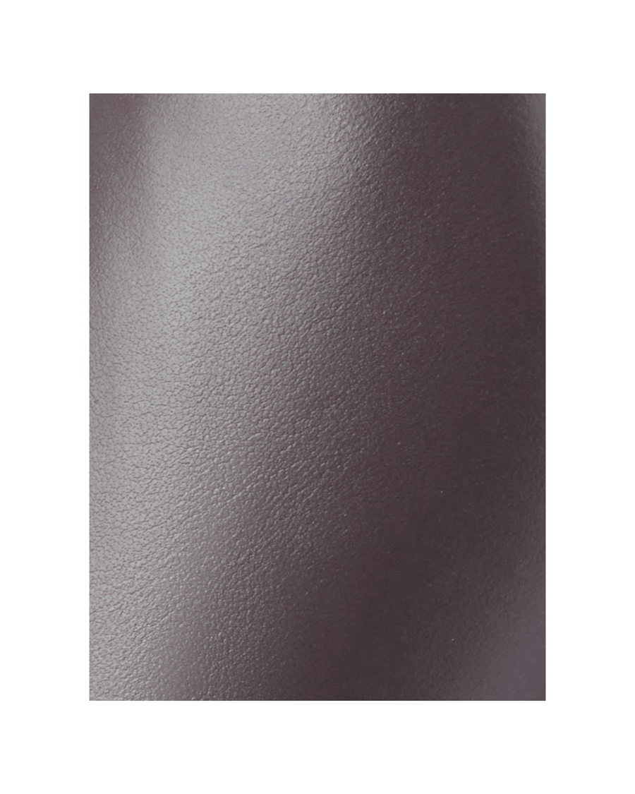 Heels made of leather, showcasing a smooth texture. The image focuses closely on the material, with no additional context or background elements visible. image
