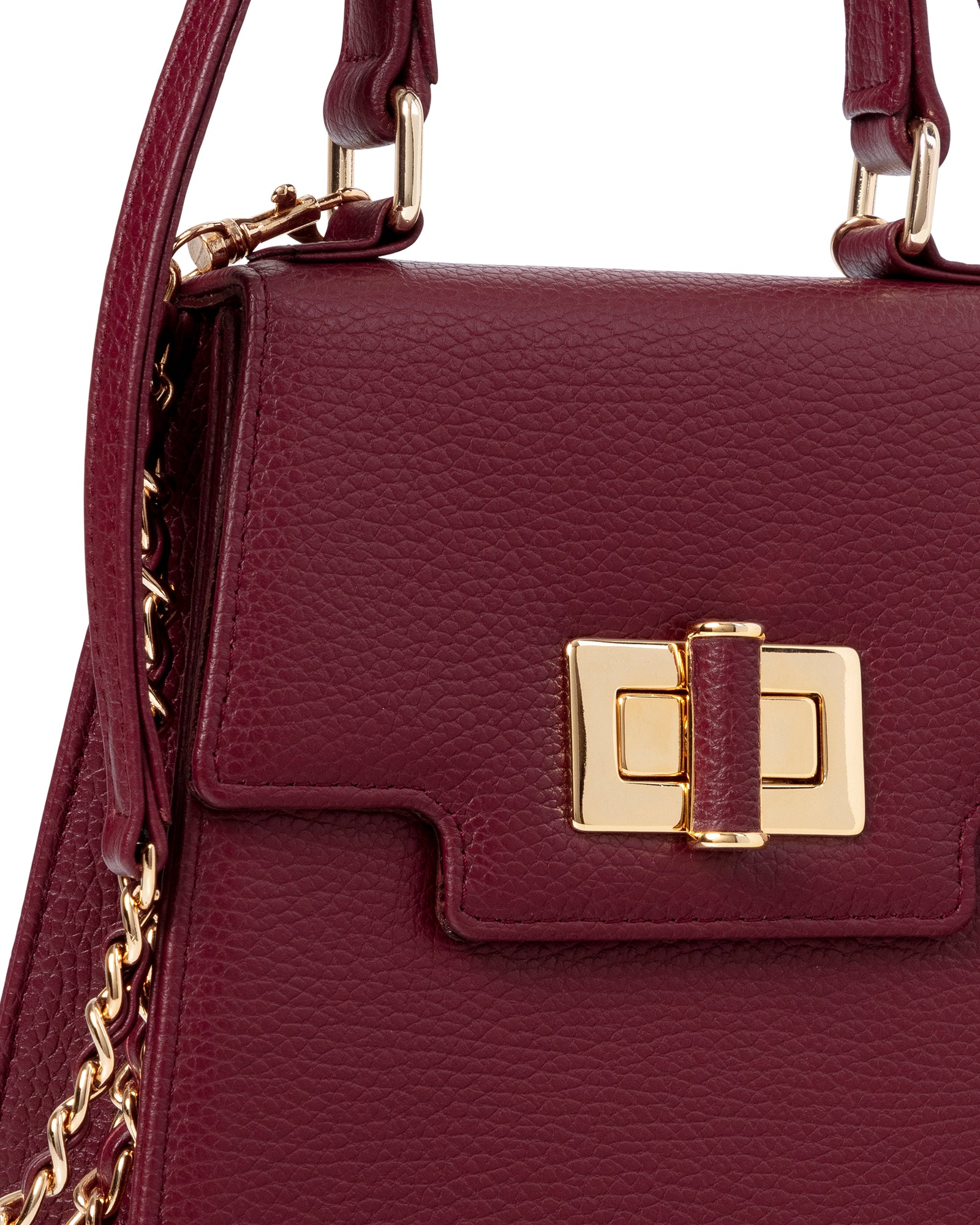 Maroon handbag with gold clasp and chain detail on a white background image