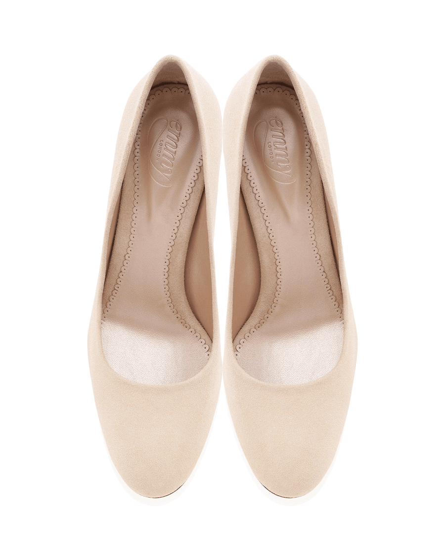 Beige suede heels with a rounded toe and a smooth interior. The shoes are displayed from a top-down angle against a white background, showcasing their clean lines and elegant design. image