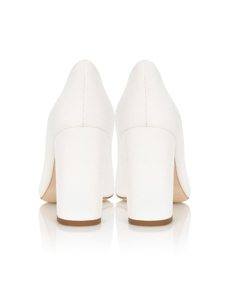 White high-heeled shoes on a white background image