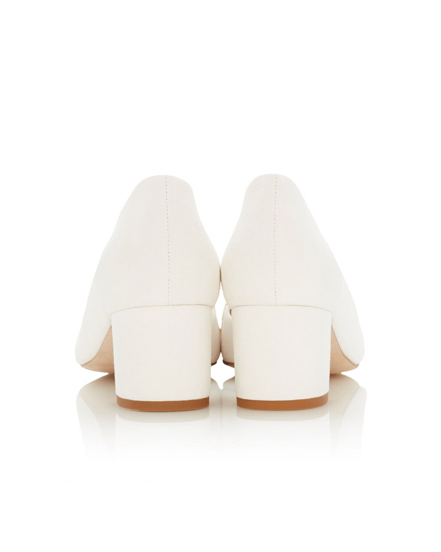 White shoes with a block heel on a white background image