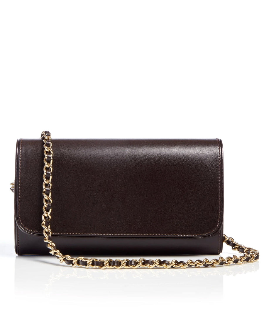 Brown leather clutch bag with a gold chain strap, displayed on a white reflective surface. The bag features a sleek, minimalist design with a flap closure, showcasing its elegant silhouette. image