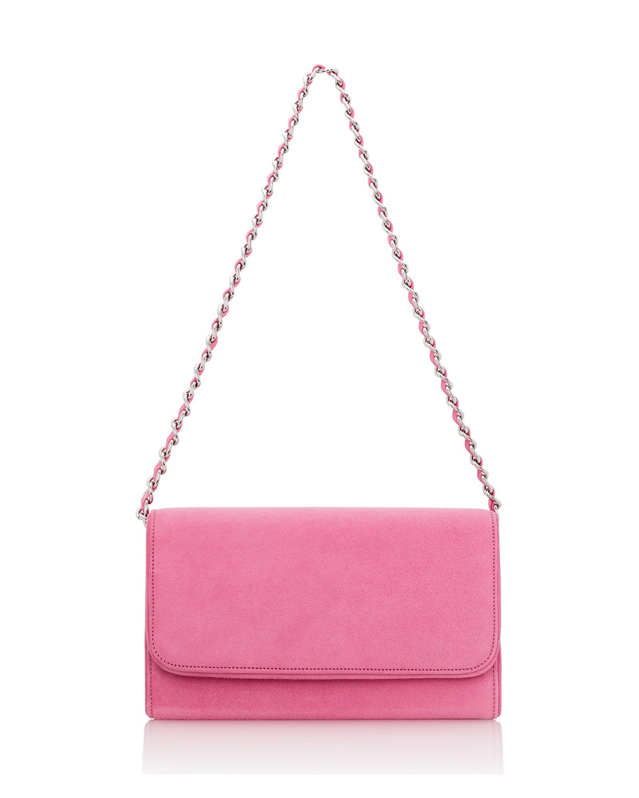 A vibrant pink suede clutch bag with a sleek design, featuring a fold-over flap and a silver chain strap. The bag is displayed against a clean, white background, highlighting its smooth texture and elegant silhouette. image