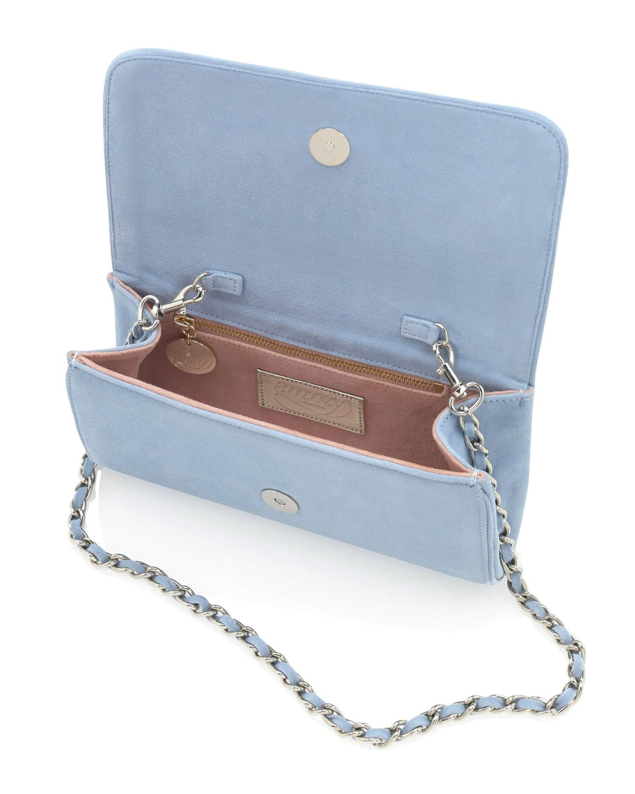 Light blue suede handbag with a chain strap, displayed open to show the interior. The background is neutral, highlighting the bag's soft texture and color. The bag features a magnetic closure and a simple, elegant design. image
