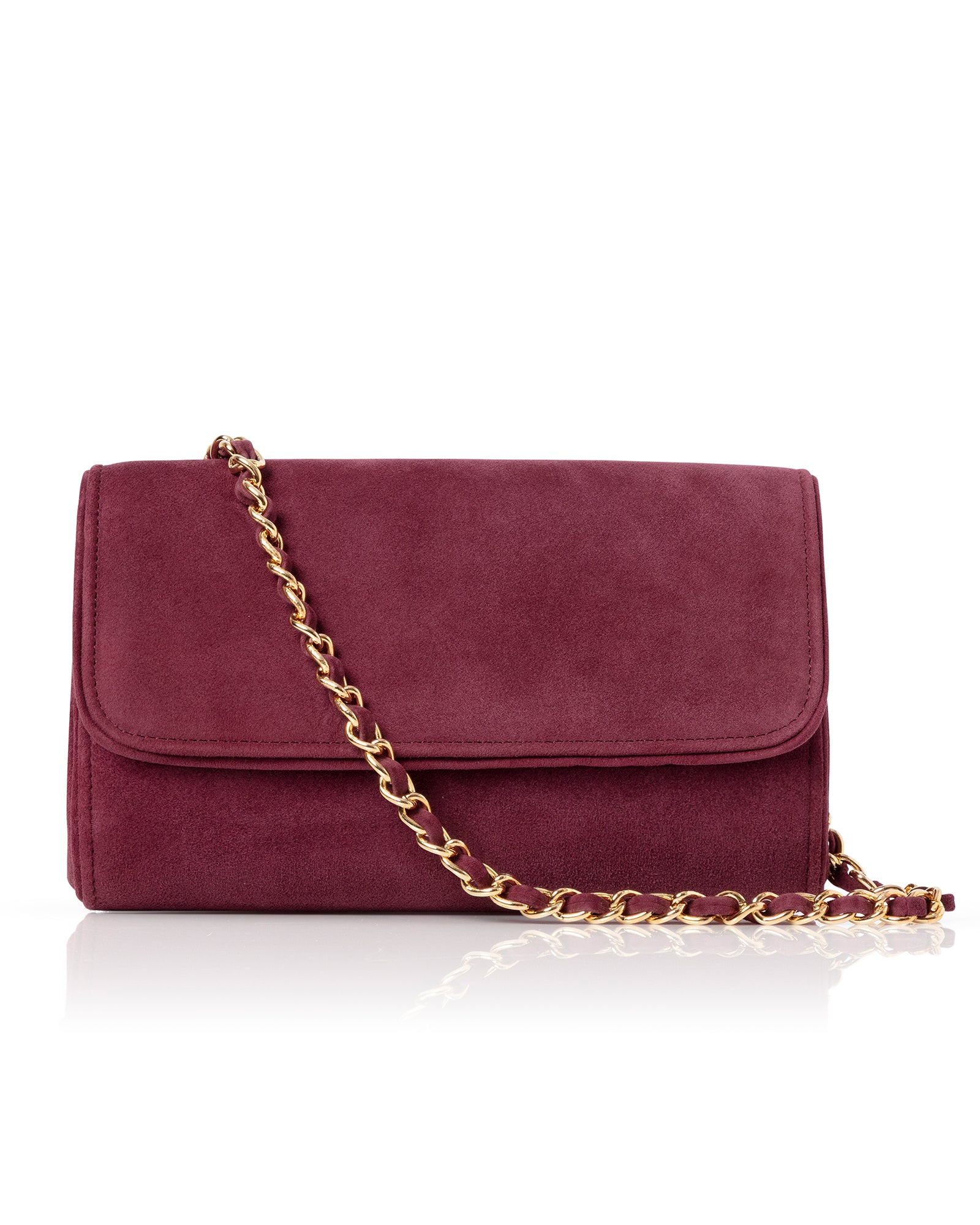 Maroon handbag with a gold chain on a white background image