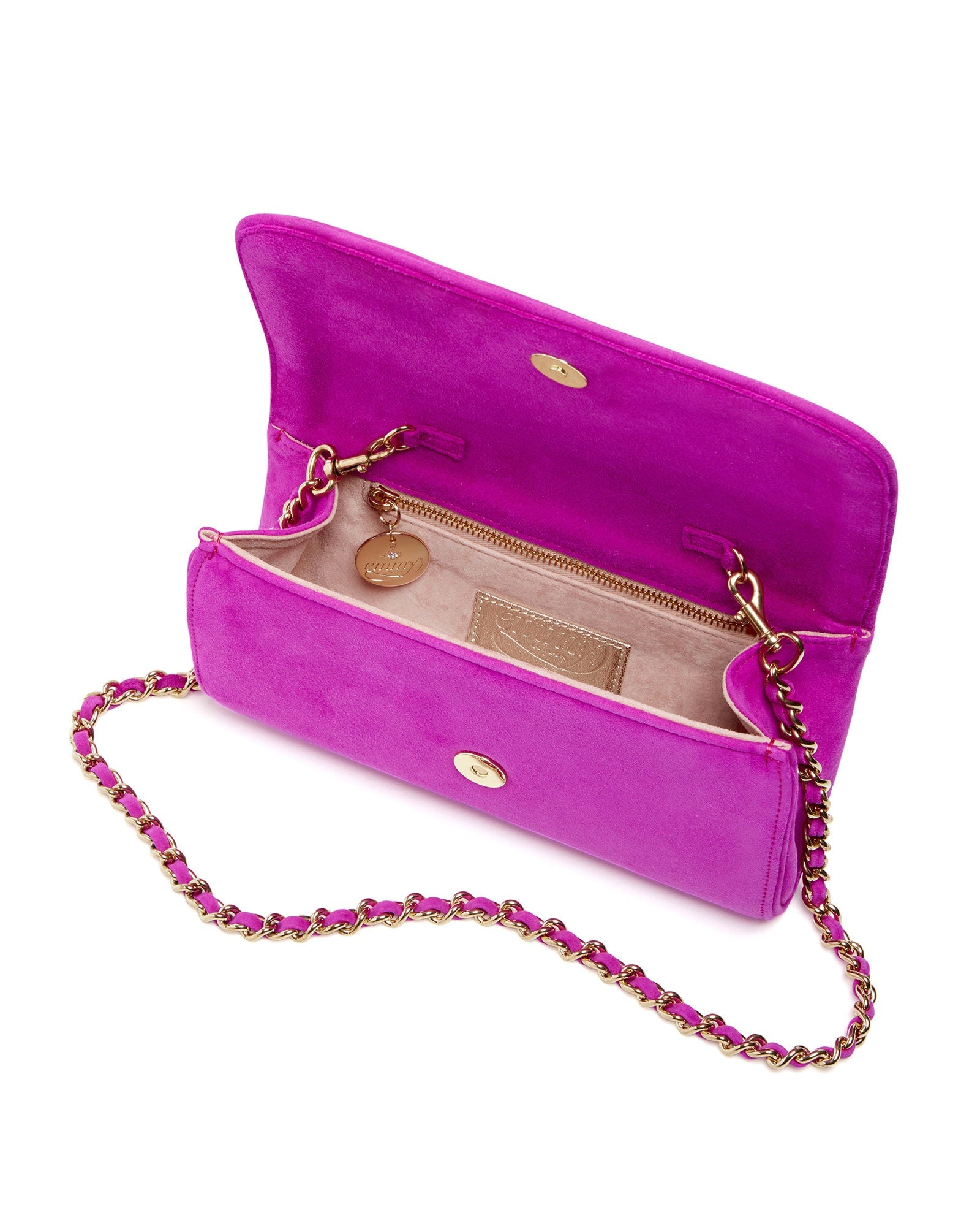 Pink suede handbag with a gold chain strap, featuring a spacious interior and a zip pocket. The bag is open, showcasing its lining and compartments, set against a white background. image