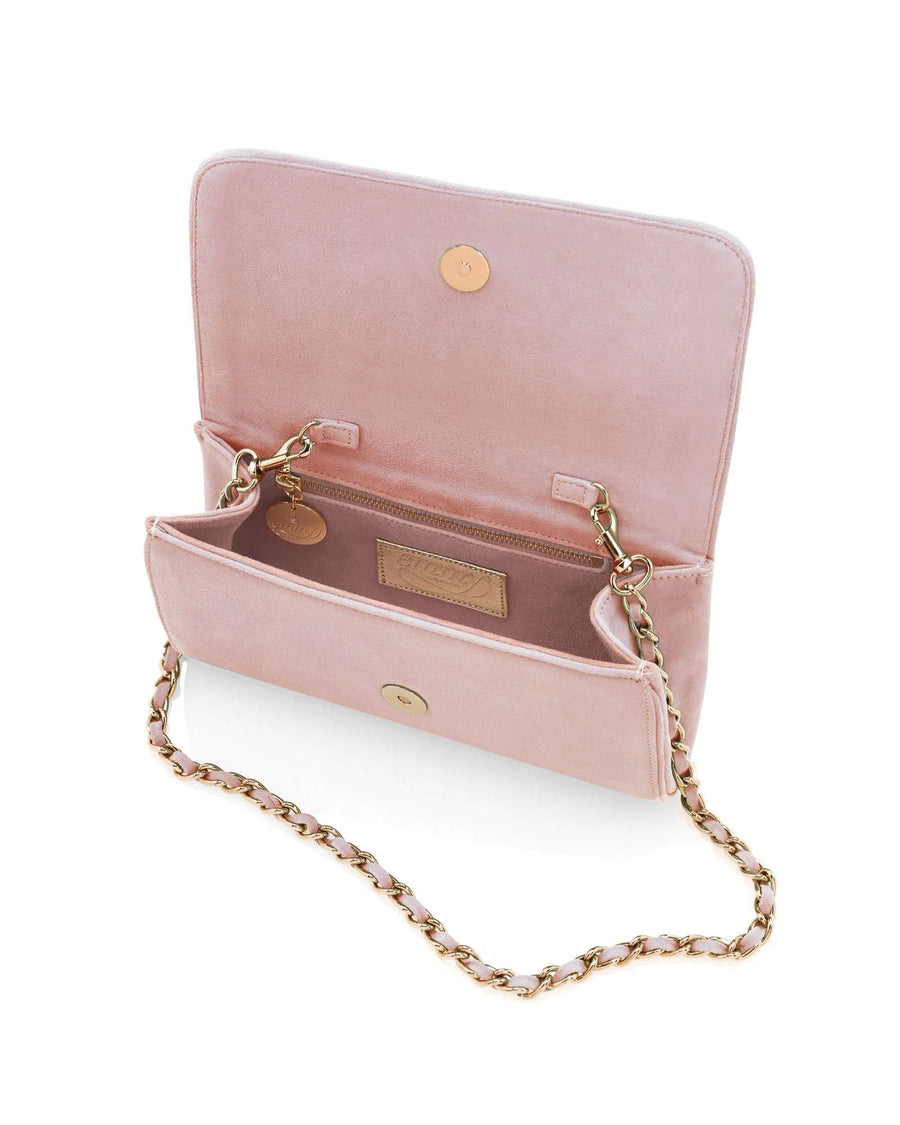 The image shows a pink suede handbag with a gold chain strap. The bag is open, revealing its interior, which features two compartments and a small pocket. The background is white, providing a clean contrast to the bag's soft color. The angle of the image is slightly above, allowing a clear view of both the exterior and interior details. image