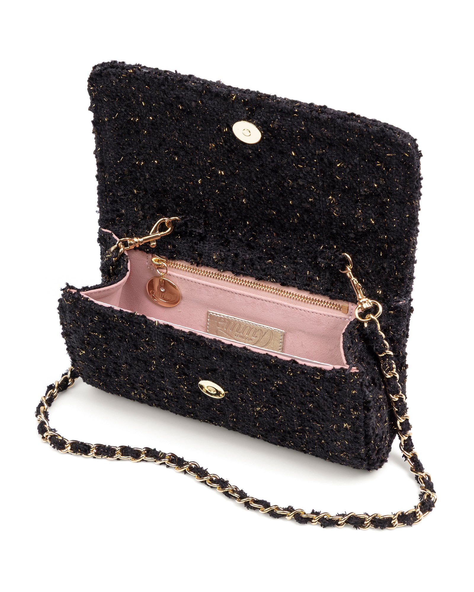 Black textured handbag with gold chain strap on a white background image