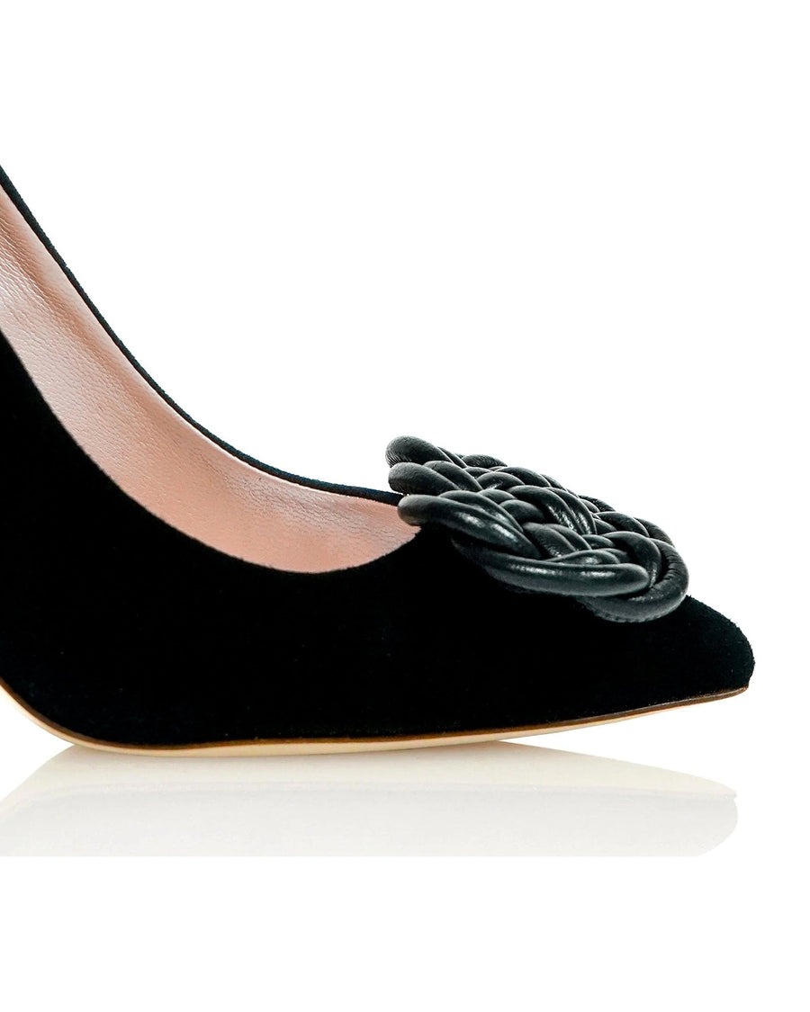 Black suede pump featuring a decorative woven detail on the toe. The shoe is shown from a side angle against a white background, highlighting its sleek silhouette and pointed toe design. The heel height is approximately 4 inches. image