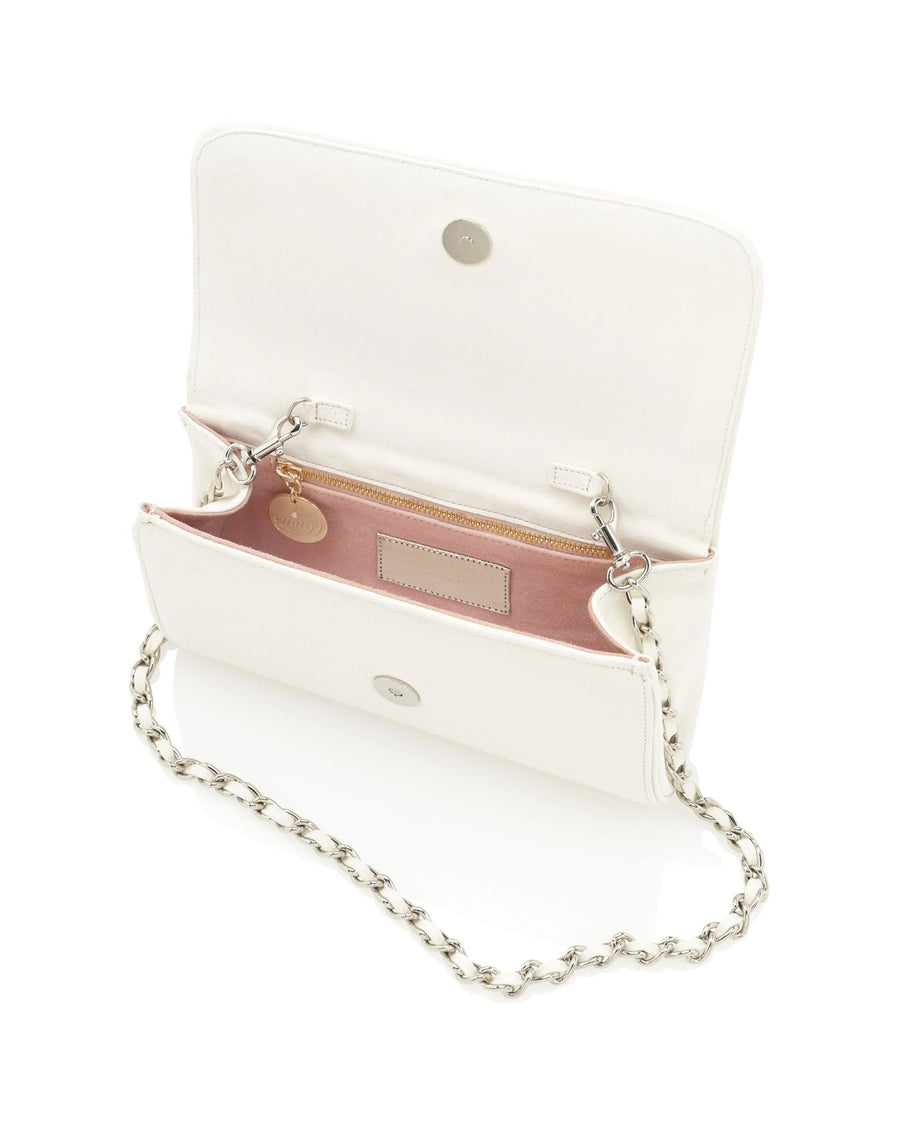 White handbag with a chain strap, featuring a spacious interior lined in pink. The bag is open, showcasing its compartments and a small tag inside. The image is taken from a top-down angle against a neutral background. image