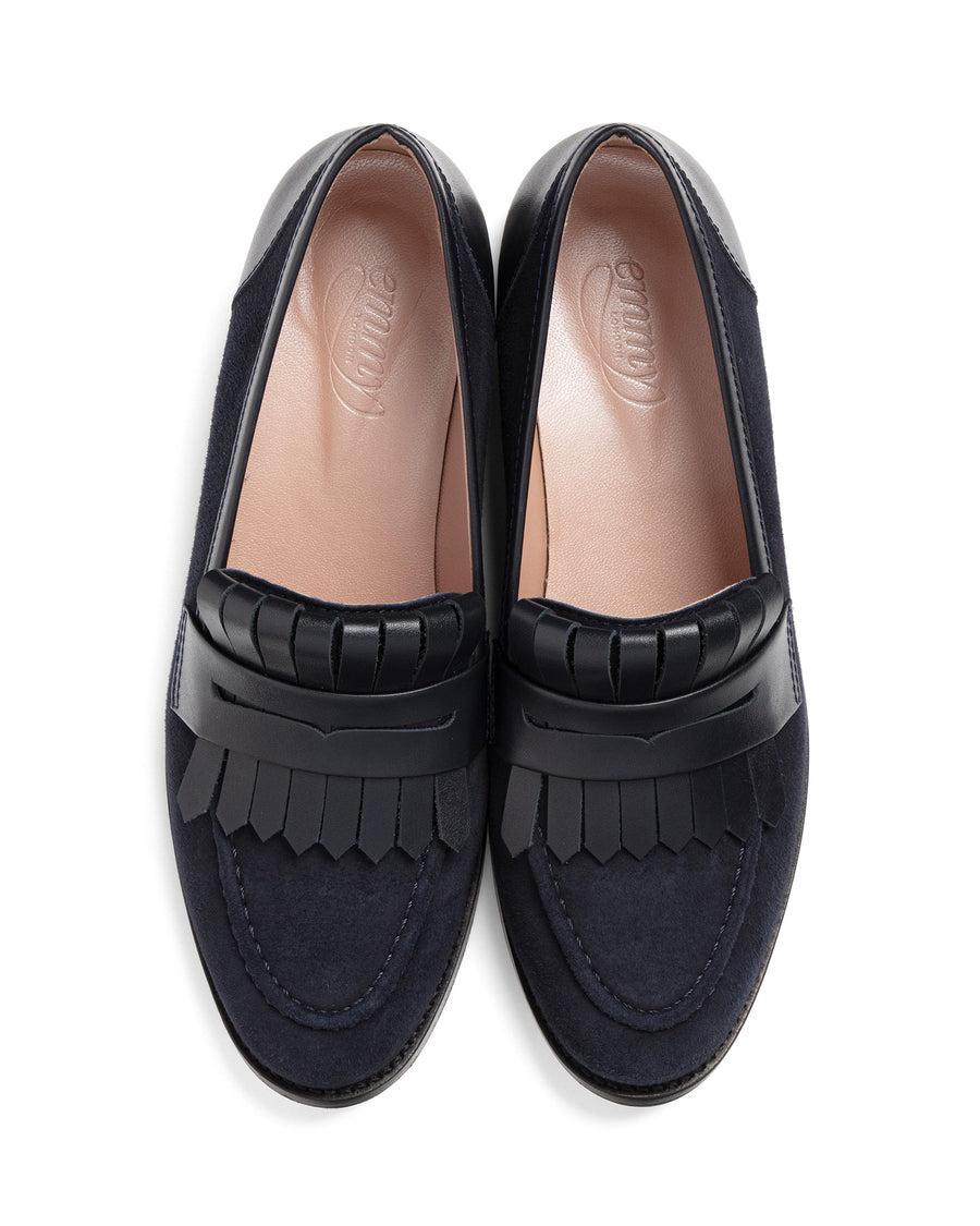 Pair of navy blue loafers with fringe details on a white background image