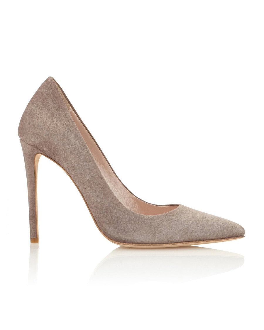 Light taupe suede high heels with a pointed toe design. The shoes feature a slender stiletto heel, approximately 4 inches in height. The image is taken from a side angle against a neutral background, showcasing the elegant silhouette of the shoe. image