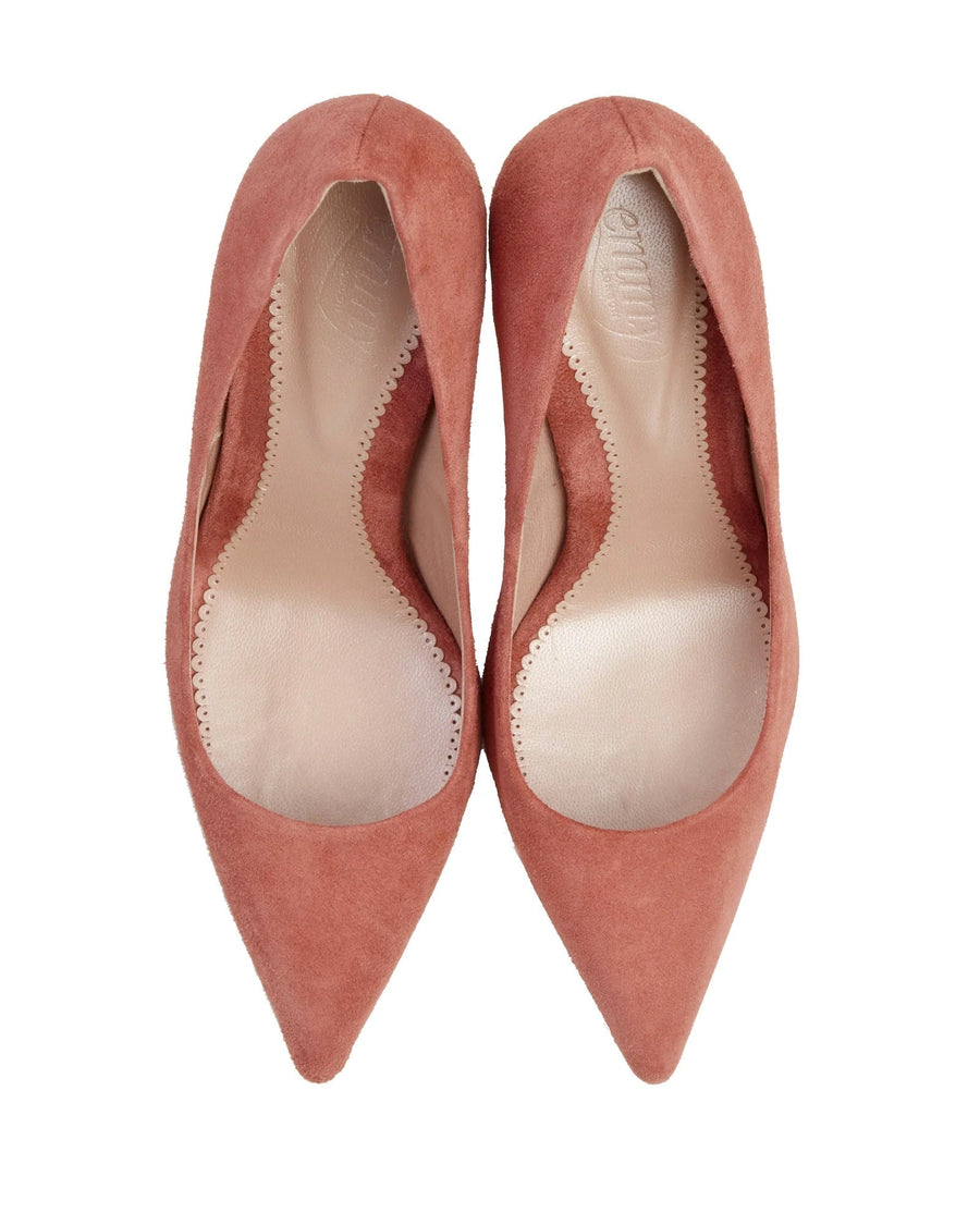Pointed-toe pumps in a soft pink suede material, featuring a sleek design with a low heel. The image is taken from a top-down angle, showcasing the smooth interior lining and the elegant silhouette of the shoes against a plain white background. image