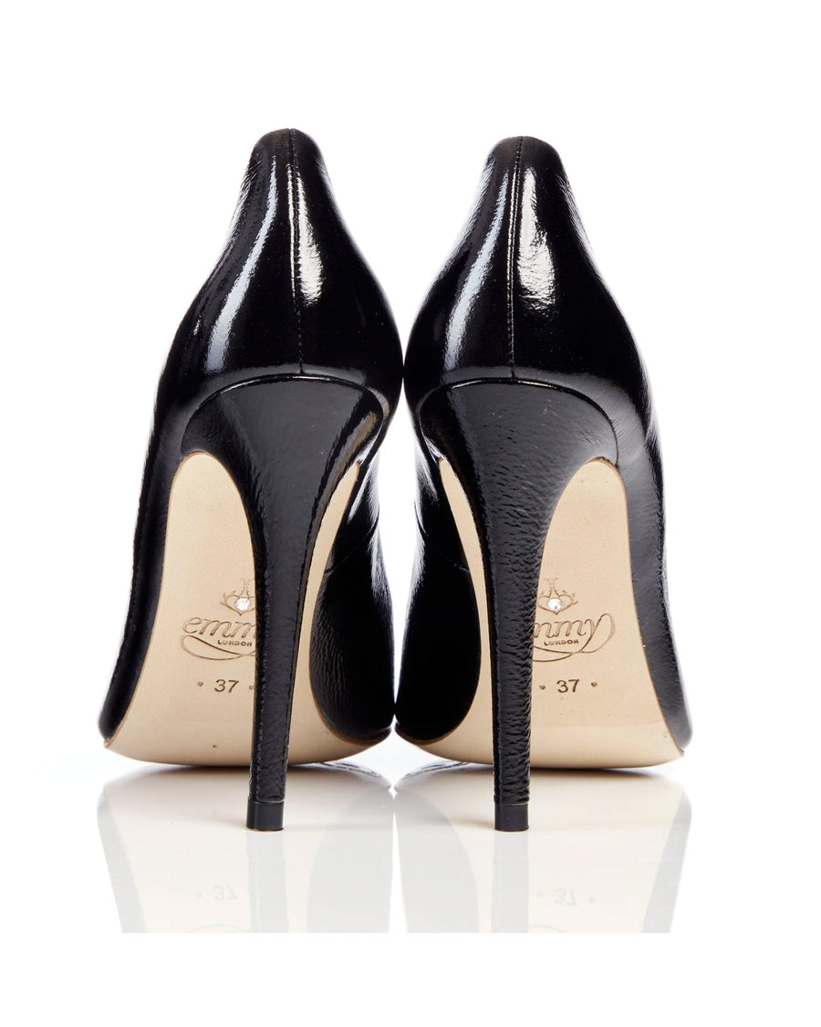 Black high heels with a glossy finish, featuring a sleek design and a pointed toe. The image shows the shoes from the back, highlighting the elegant silhouette and the height of the heels. The background is plain white, emphasizing the shoes' details. image