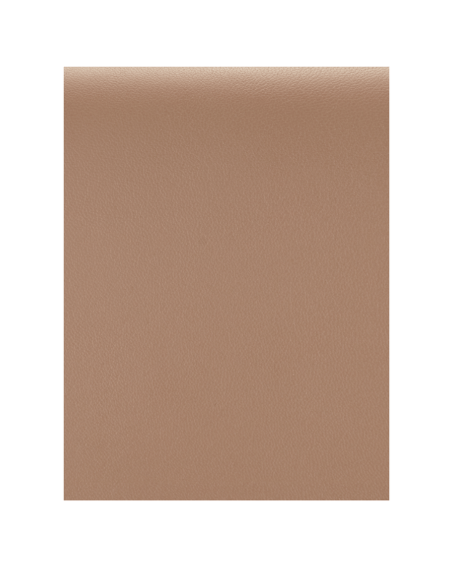 The image features a smooth, beige leather material with a subtle texture. The background is plain, allowing the focus to remain on the material itself. There are no shoes or heels present in the image. image