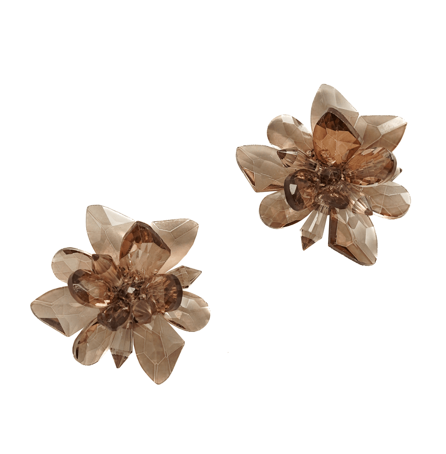 This image features a pair of decorative flower-shaped accessories in a soft, translucent brown hue. The flowers are composed of multiple petal-like layers, creating a three-dimensional effect. The background is plain white, allowing the details of the accessories to stand out clearly. There are no shoes or heels present in this image. image